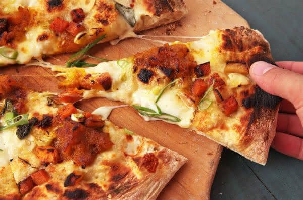 a pizza on a wooden board